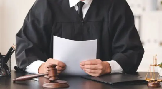 judge holding court decision