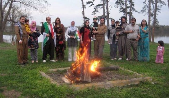 Pakhshan and group around fire