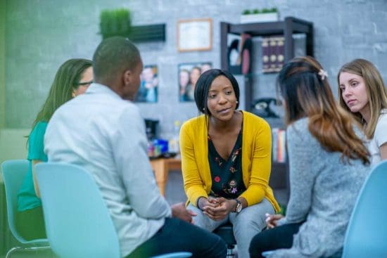 young people in group counseling session