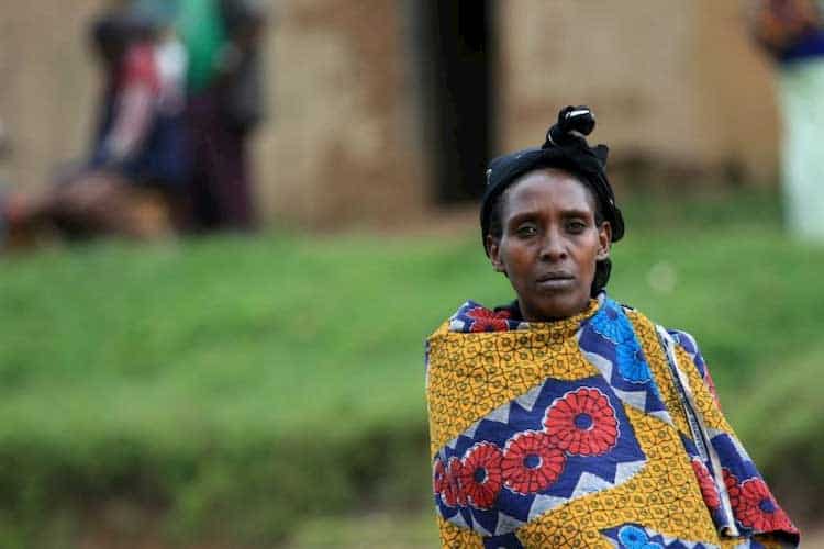 older woman wrapped in colorful cloth