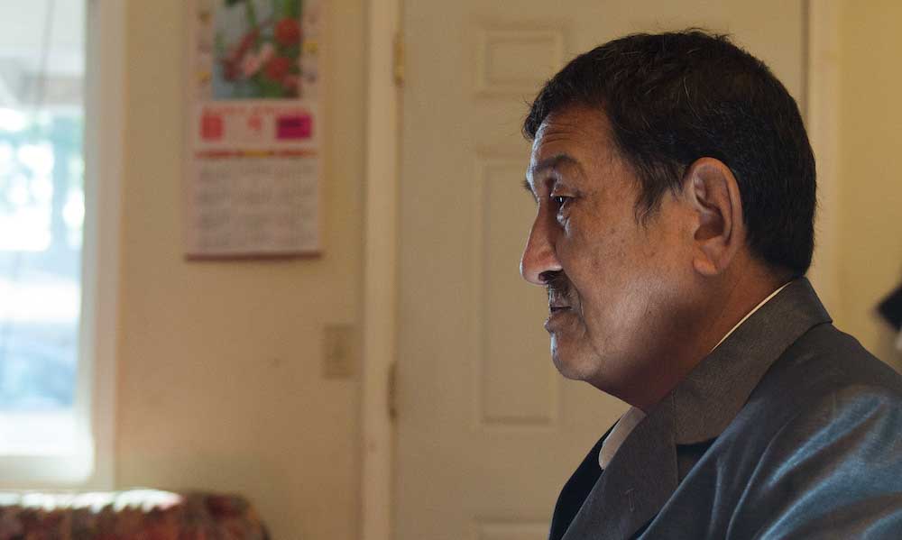 profile view of an older man staring ahead