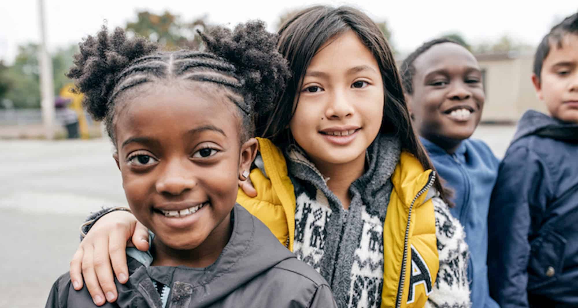 young school friends outside school