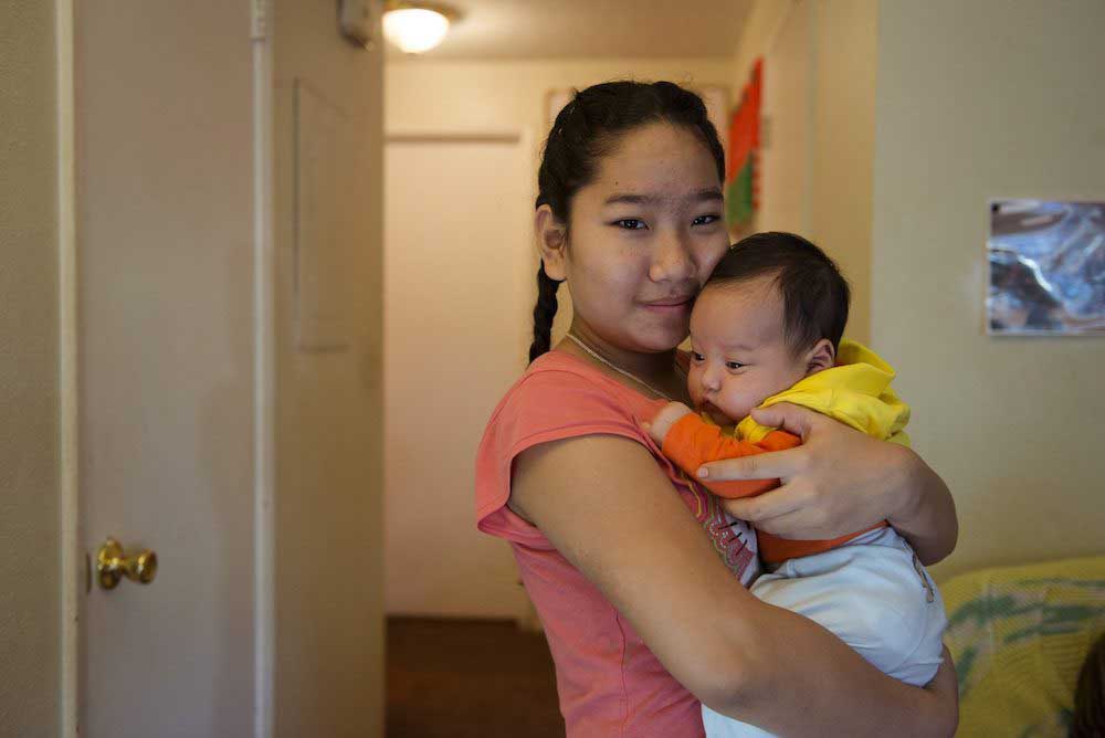 teenage-girl-holding-baby.jpg