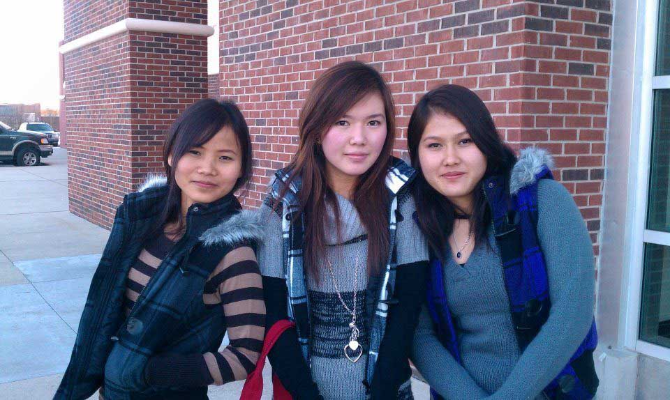 three high school girls outside school