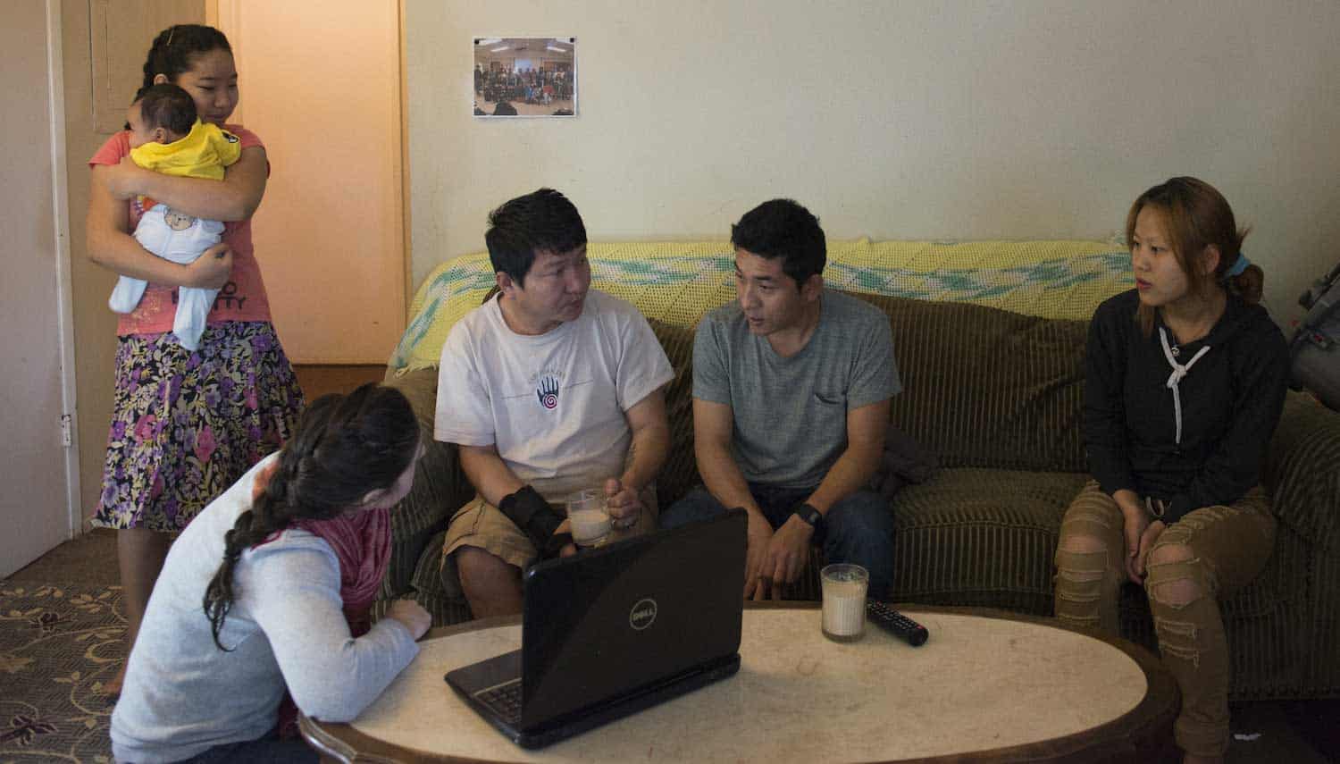 young family group talking at home