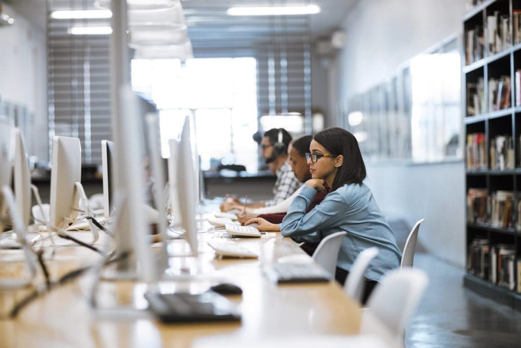 people working on computers in an office