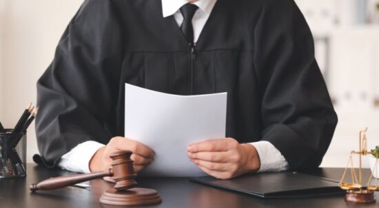 judge holding court decision